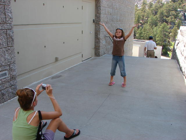 Easton was getting a picture of Conli holding up Mount Rushmore.