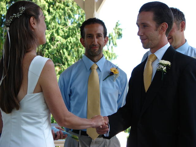 Josh looks on as Ben and Lindsay join hands.