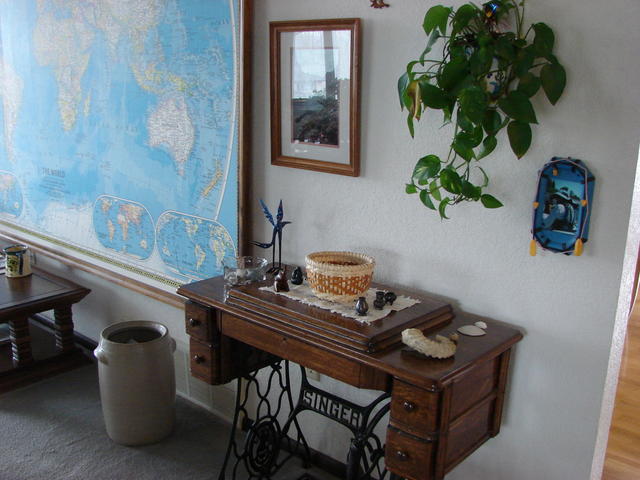 I got the sewing machine cabinet from the trash in Michigan and refinished it.  The basket is a gift from Lindsay, fossil is fro