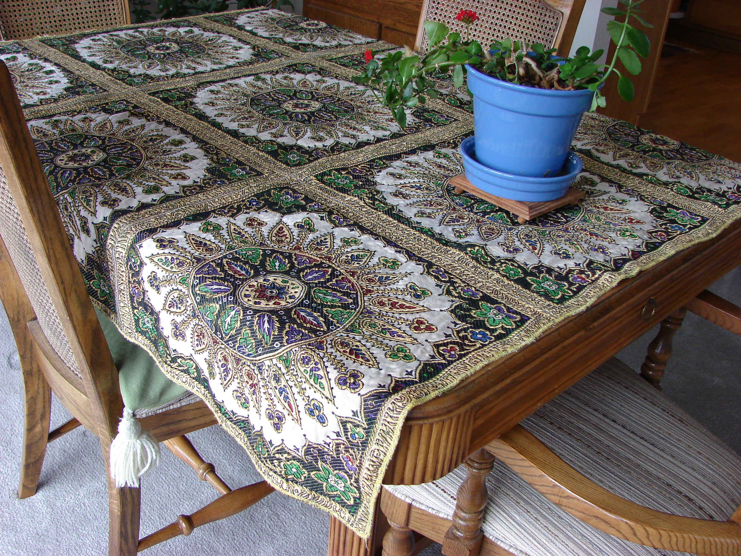 Table cloth from Morocco, cost around $150.  Table bought in Michigan and I refinished it.  Larry Lynam made the leaf for it.