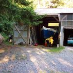 In the shop is another sailboat and to the left is the trimaran that Rob sails.