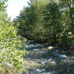 Can you see the little red wagon on the bridge?