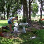 Here's my sister Donna working in her flower garden.