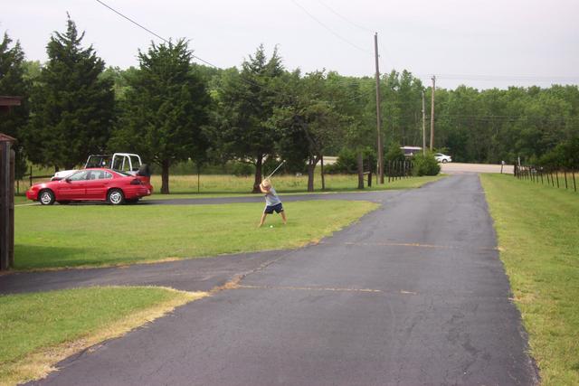 Dakota, the blond neighbor boy, is quite a golfer.