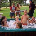 All the kids enjoy the swimming pool.