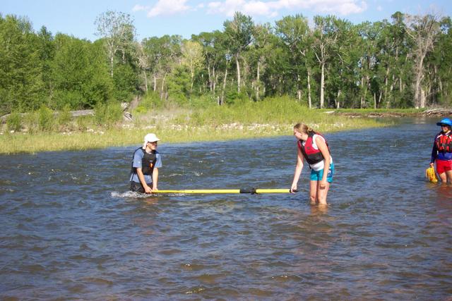 Now we're practicing our safety demonstration.  Pretend the oar is a strainer and try to get over the top of it.