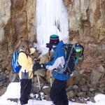 Jeremy and Kelsiann look like they're touching the frozen waterfall.  The water comes right out of the rock.